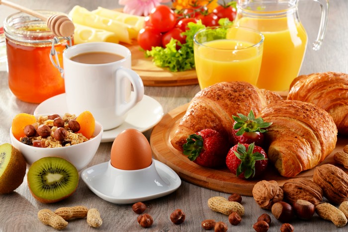 Breakfast with Croissants, Coffee, Juice, and Fruit