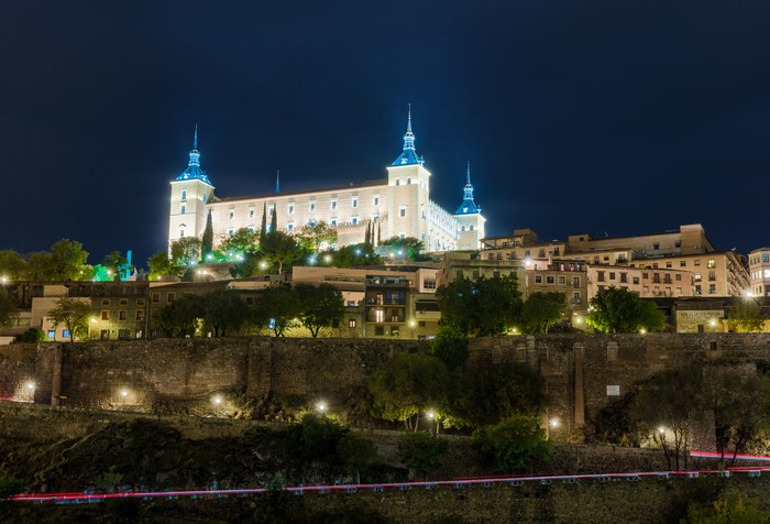 Toledo cityscape at night with illuminated palace