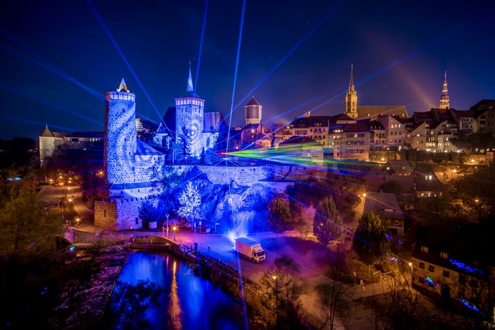 Bautzen Fortress illuminated with light rays at night