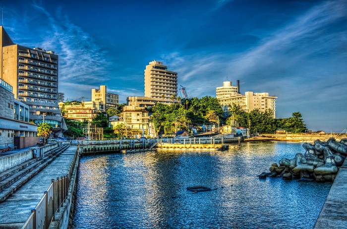 Coastal cityscape with buildings and a harbor in Wakayama, Japan