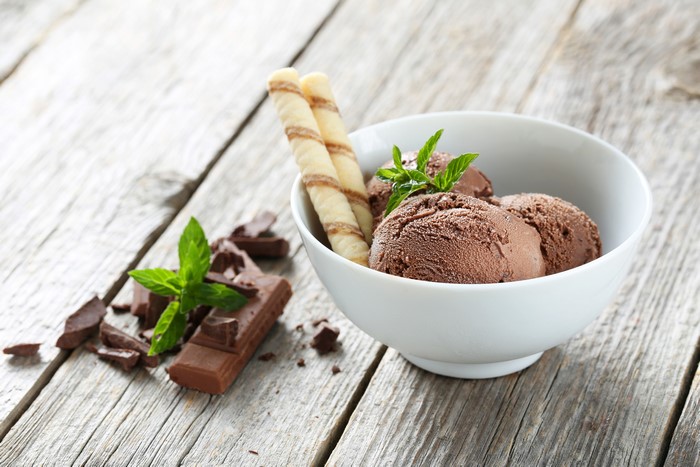 Chocolate ice cream with wafer rolls and chocolate bar