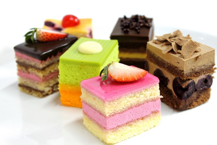 Assortment of small cakes on a white background