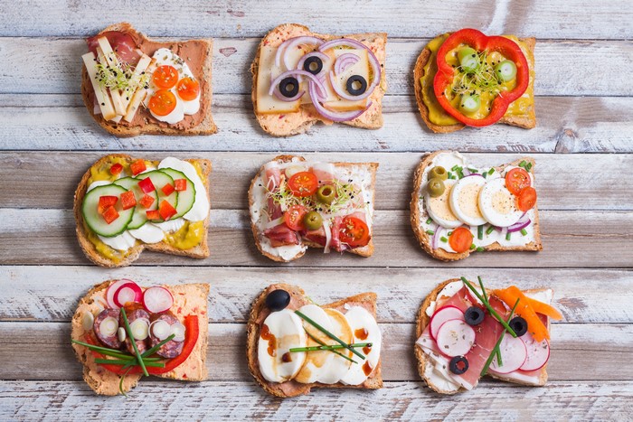 Colorful Open-Faced Sandwiches on Rustic Wood Planks