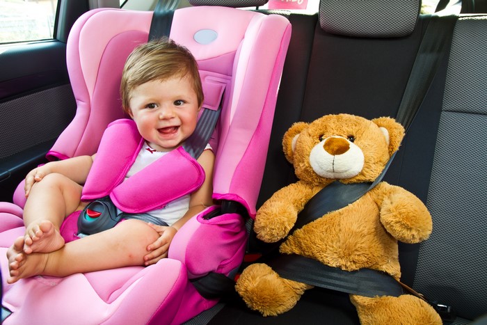 Baby and Teddy Bear in Car Seat
