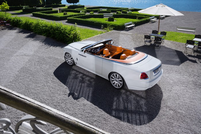 White Rolls-Royce Dawn Cabriolet by a Lake
