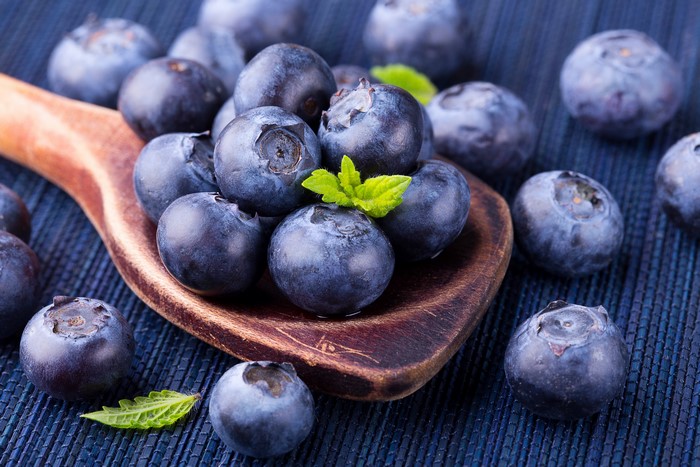 Blueberries on a wooden spoon