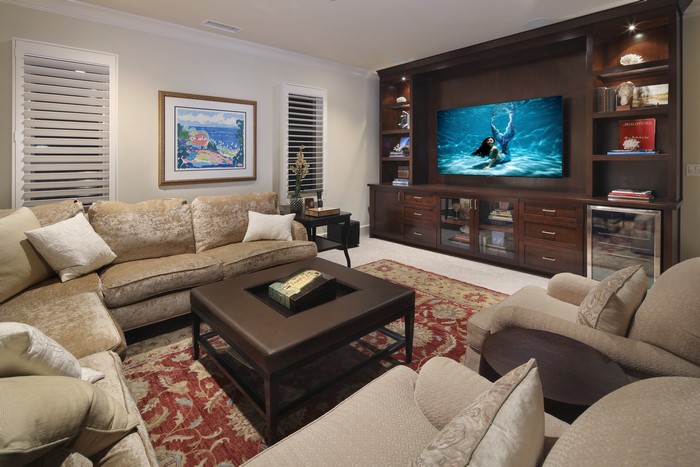Living room with sectional sofa and entertainment center