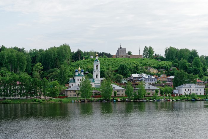 Riverfront village with churches and houses in Ples, Russia