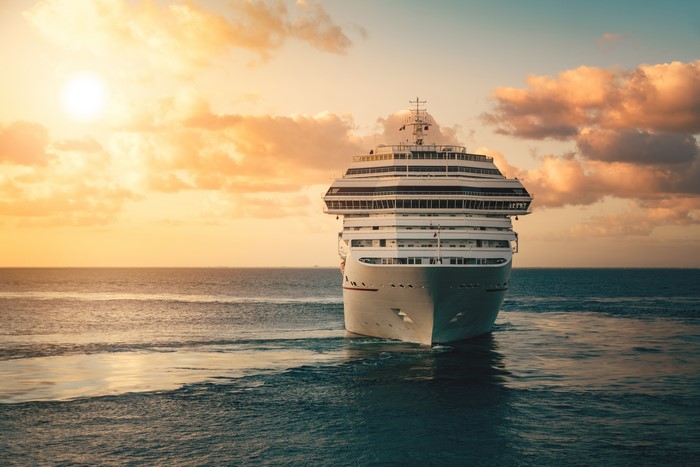 Cruise liner sailing on the sea at sunset