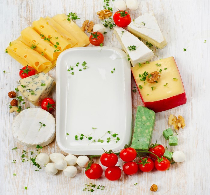 Cheese platter with tomatoes and nuts