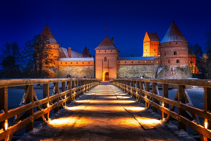 Trakai Castle in Lithuania at night with a bridge