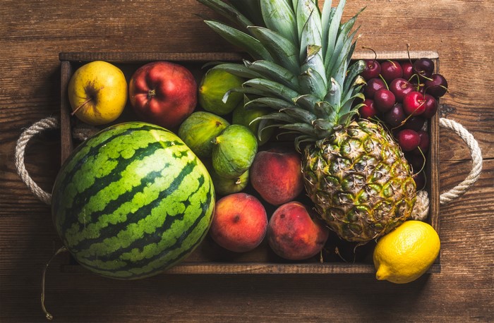 Assortment of Fresh Fruits in a Wooden Crate
