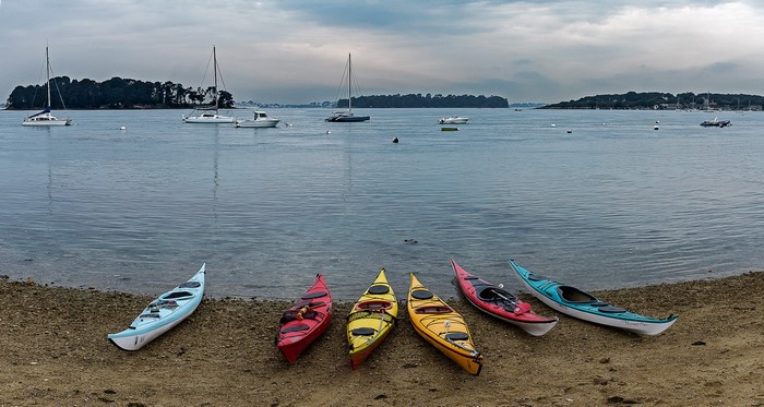 Kayaks on the shore in Larmor-Baden, Brittany, France