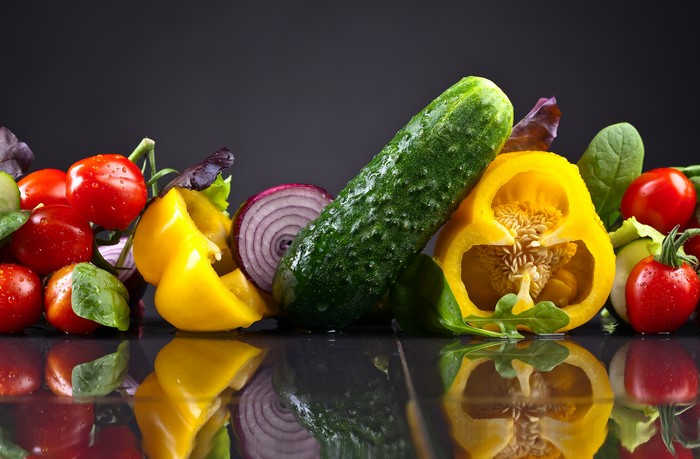 Vegetables: Tomatoes, Cucumbers, Bell Pepper, Onion with Reflection