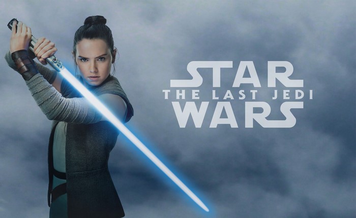 Rey from Star Wars: The Last Jedi with a lightsaber