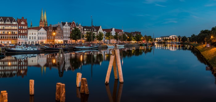 Luebeck Germany Riverfront Evening with Houses and Boats