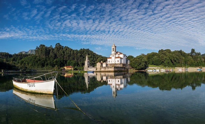 Church and boat in Villaviciosa, Spain