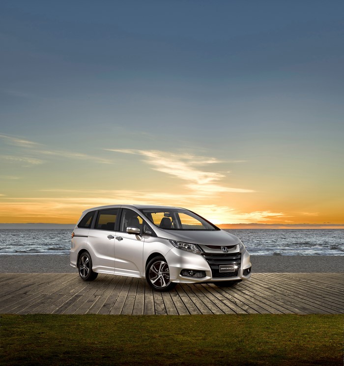 Silver Honda Odyssey VTi-L on a wooden deck by the sea