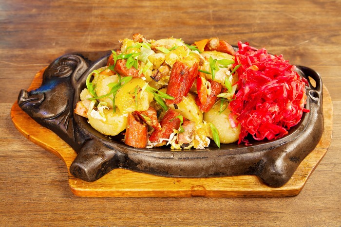 Sizzling Platter with Potatoes, Sausage, and Red Cabbage