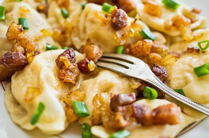 Dumplings with fried onions and green onions