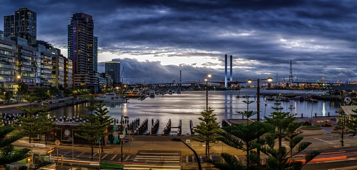 Melbourne waterfront at dusk with bridges and boats