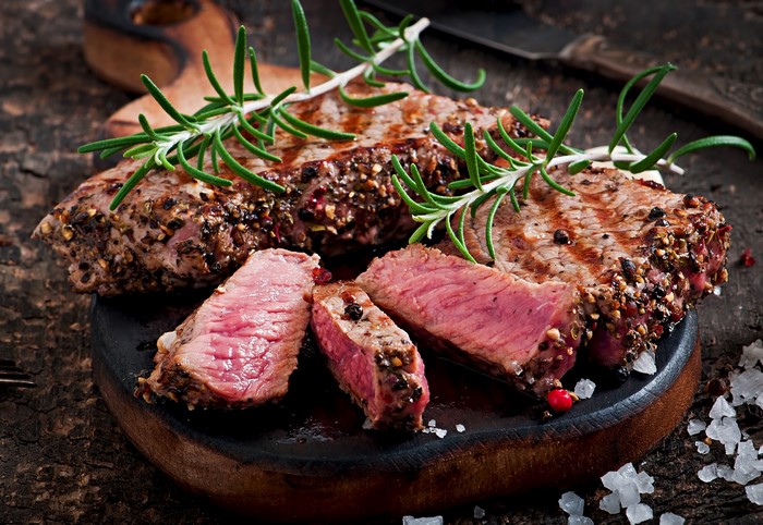 Cooked steak with rosemary and salt