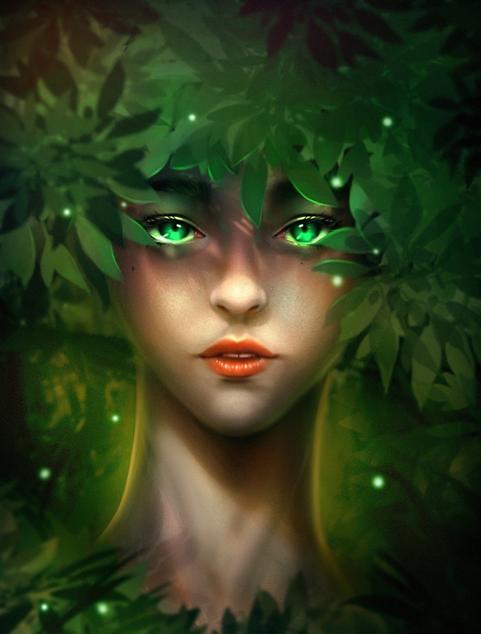 Woman with green eyes peeking through foliage
