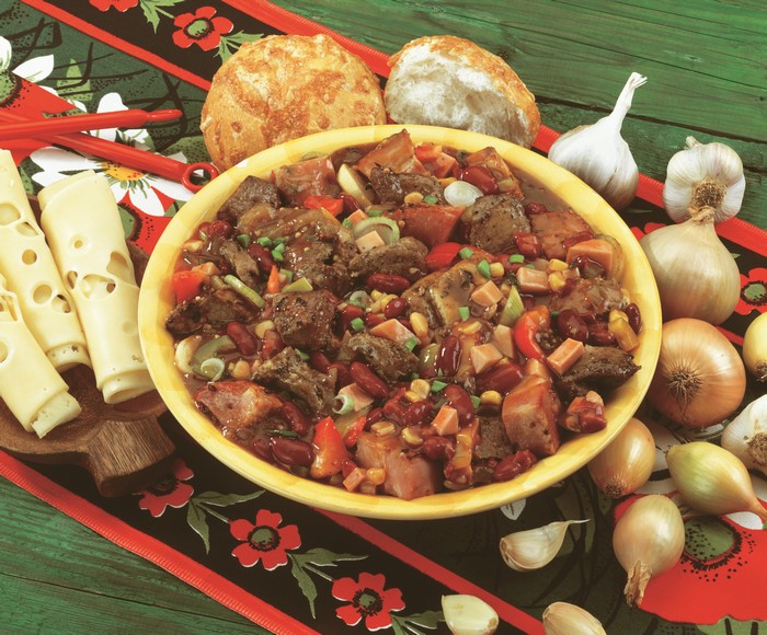 Hearty Stew with Bread, Cheese, and Onions