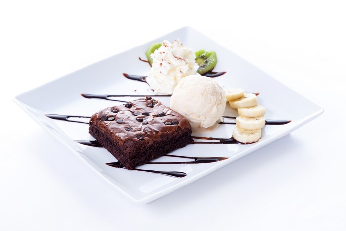 Chocolate brownie with ice cream and fruit