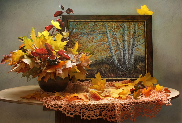Autumn still life with painting and leaves
