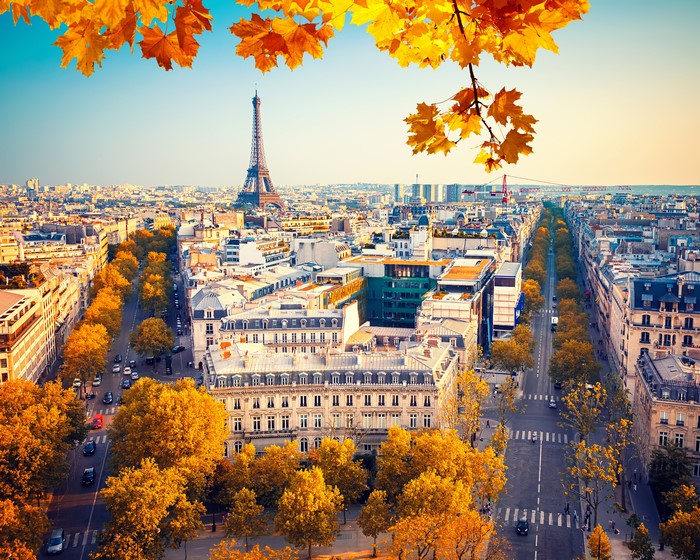 Parisian street with Eiffel Tower in autumn