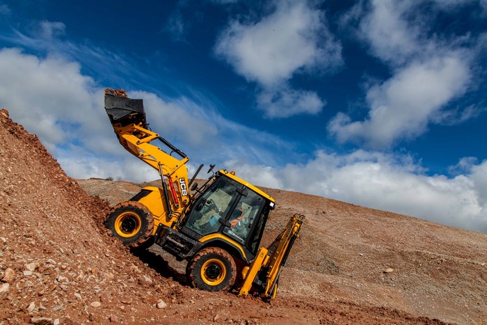 JCB 3CX Compact Loader on a dirt pile
