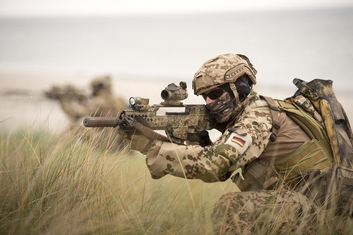 German soldiers with assault rifles in camouflage