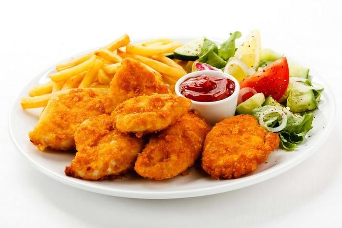 Chicken nuggets with french fries and salad
