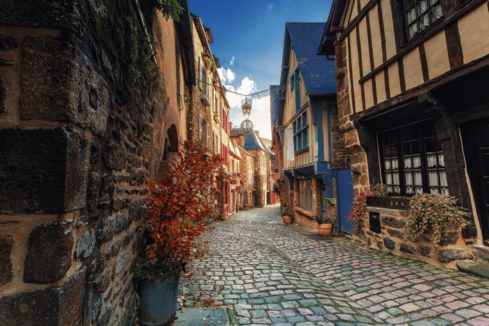 Street in Dinan, Brittany, France with Houses and Street Lights