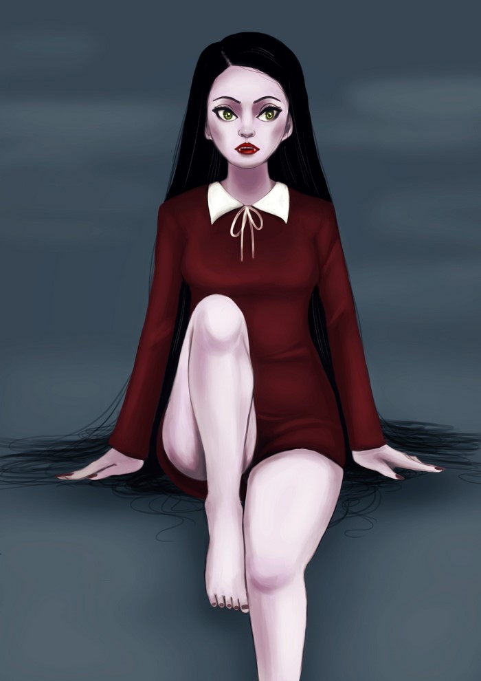 Vampire girl in a red dress sitting