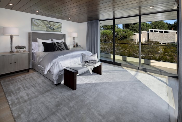 Modern Bedroom with Large Window and Artwork