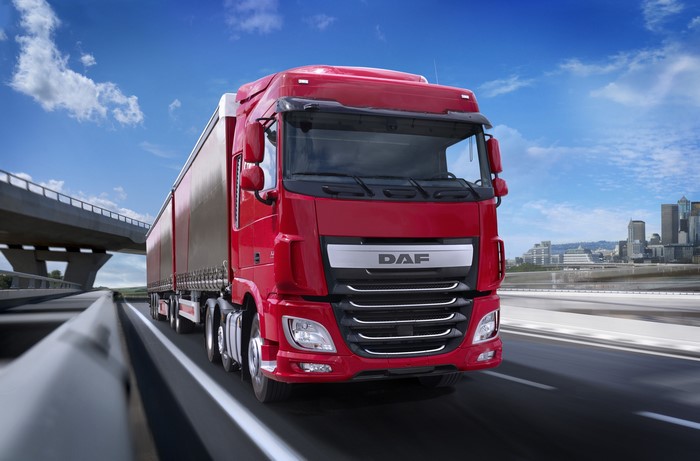Red DAF Truck Driving on Highway