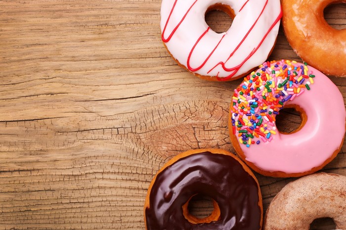 Assorted Donuts on Wooden Surface