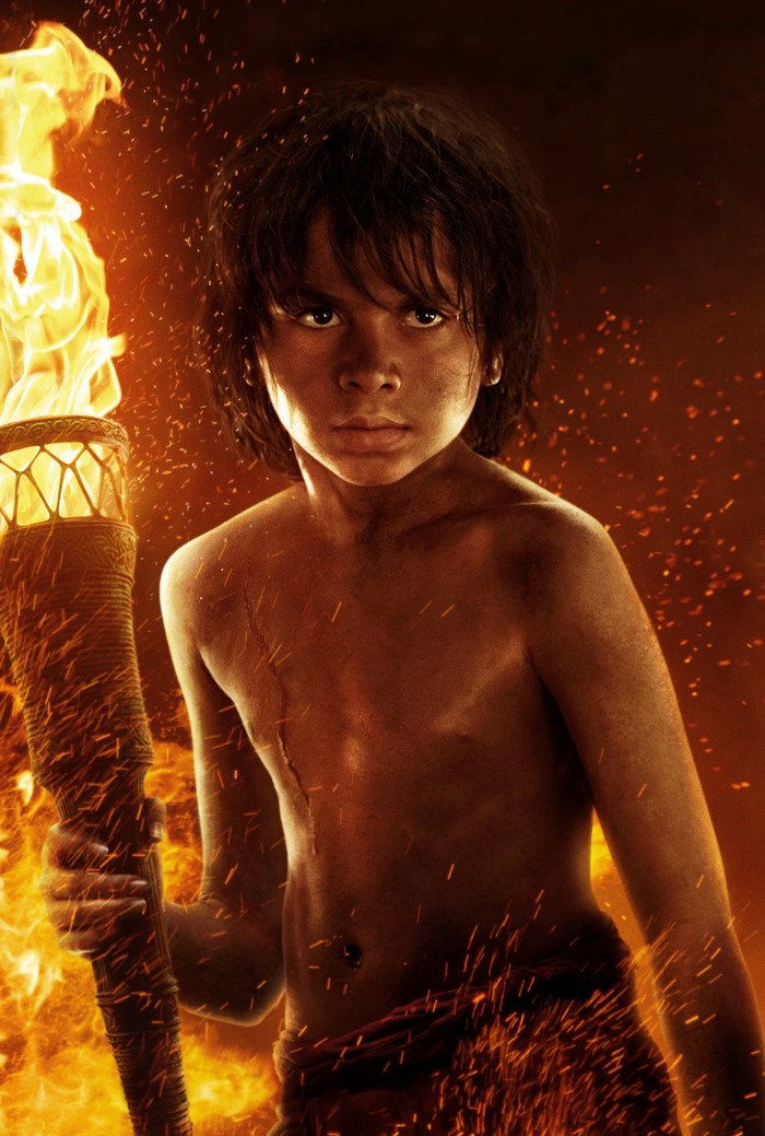 Mowgli from The Jungle Book 2016 holding a torch