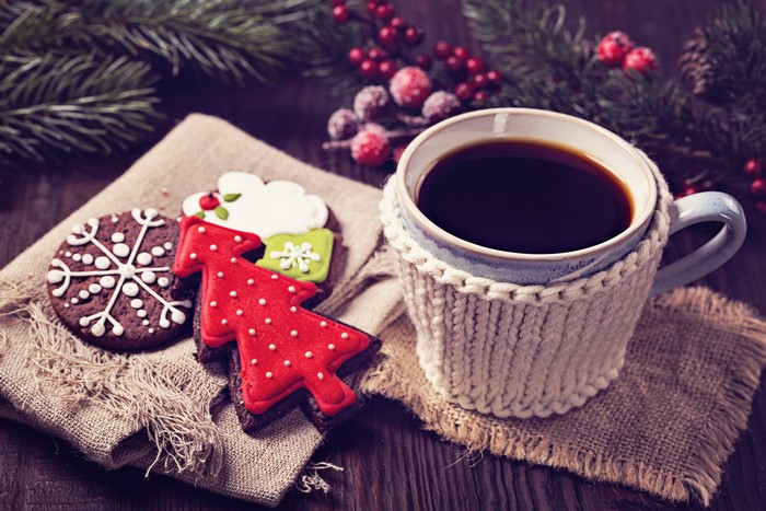Christmas coffee and cookies with pine branches
