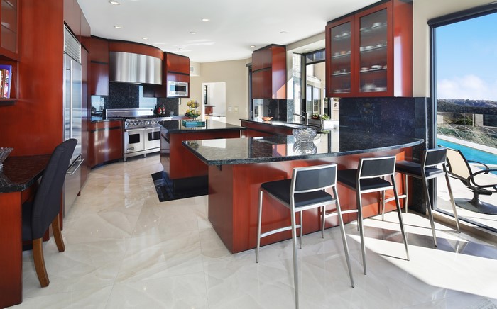 Modern kitchen with island and pool view