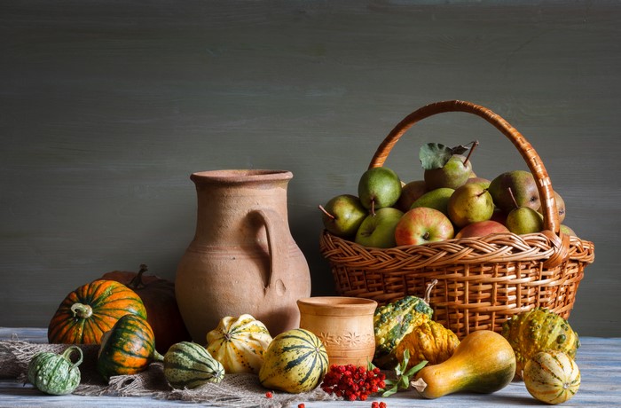 Still-life of apples, pears, pumpkins, and a jug