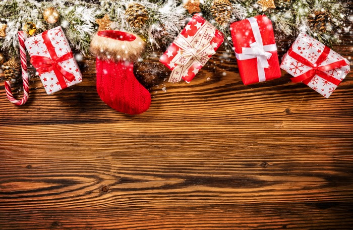 Christmas Gifts and Stocking on Wood