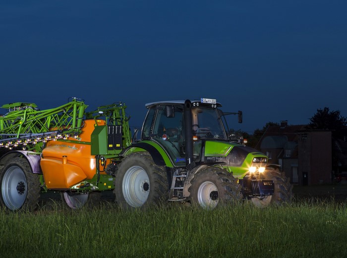 Deutz-Fahr Agrotron TTV 410 tractor with sprayer at dusk