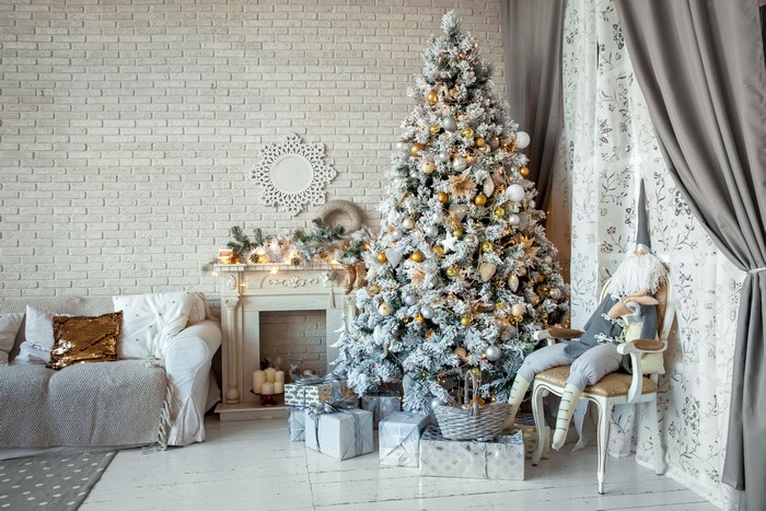 Christmas tree and gifts in a decorated room