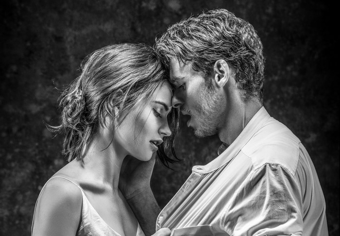 Richard Madden and Lily James in black and white