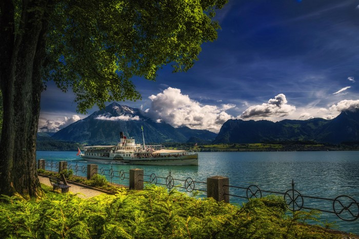 Riverboat on Lake Thun with Mountains, Switzerland