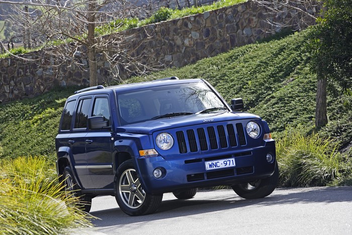 Blue Jeep Patriot Limited on a Hillside