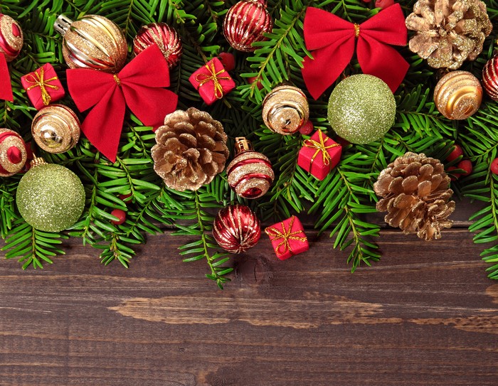 Christmas ornaments and pine cones on fir branches